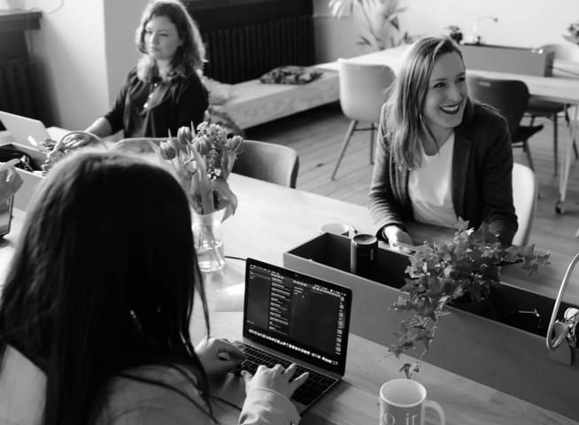 women working and laughing